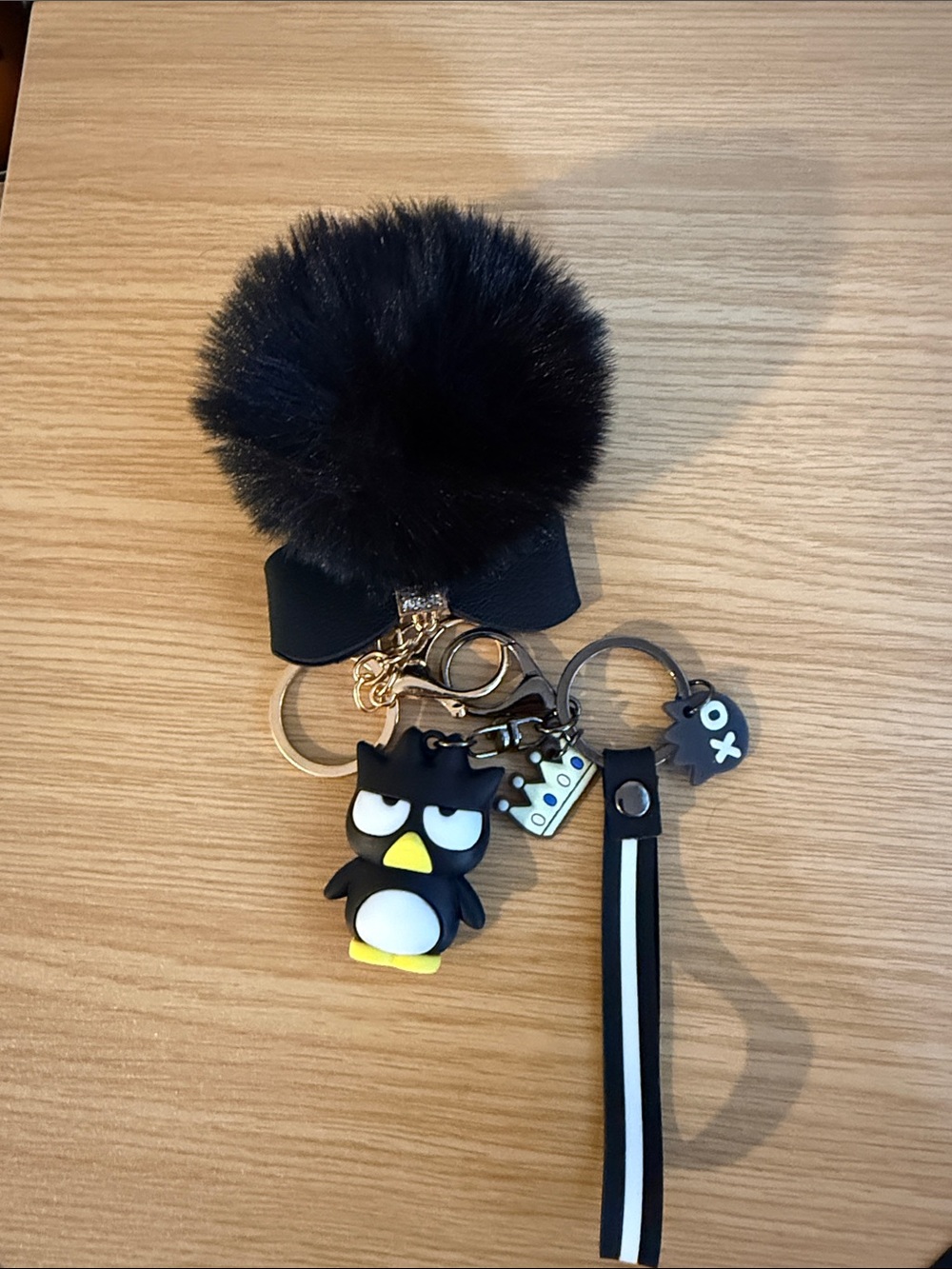 Black Pom-Pom Bow Keychain with Angry Penguin Charm